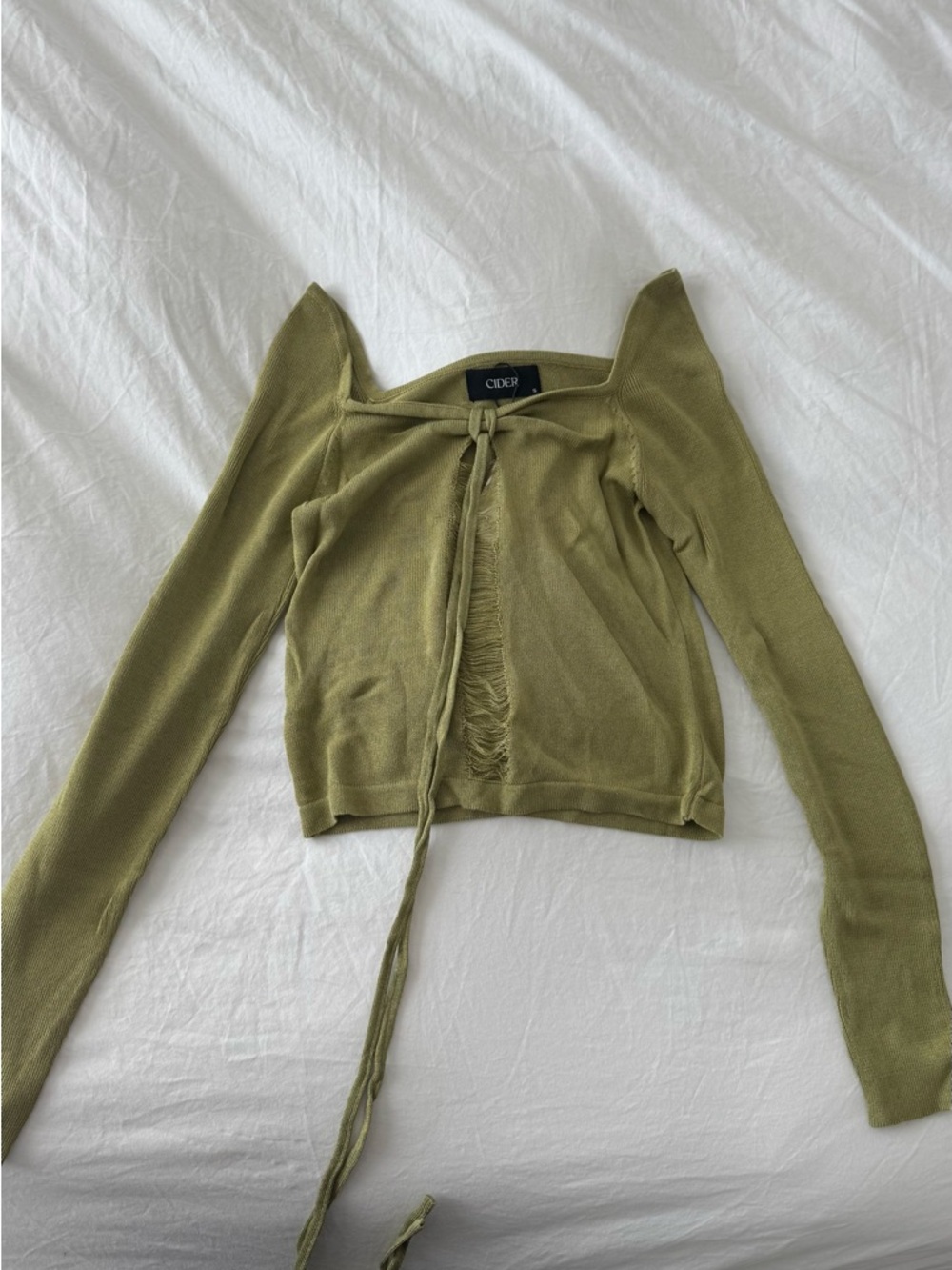 Green knitted long sleeve top with tie-up lace in and distressed details